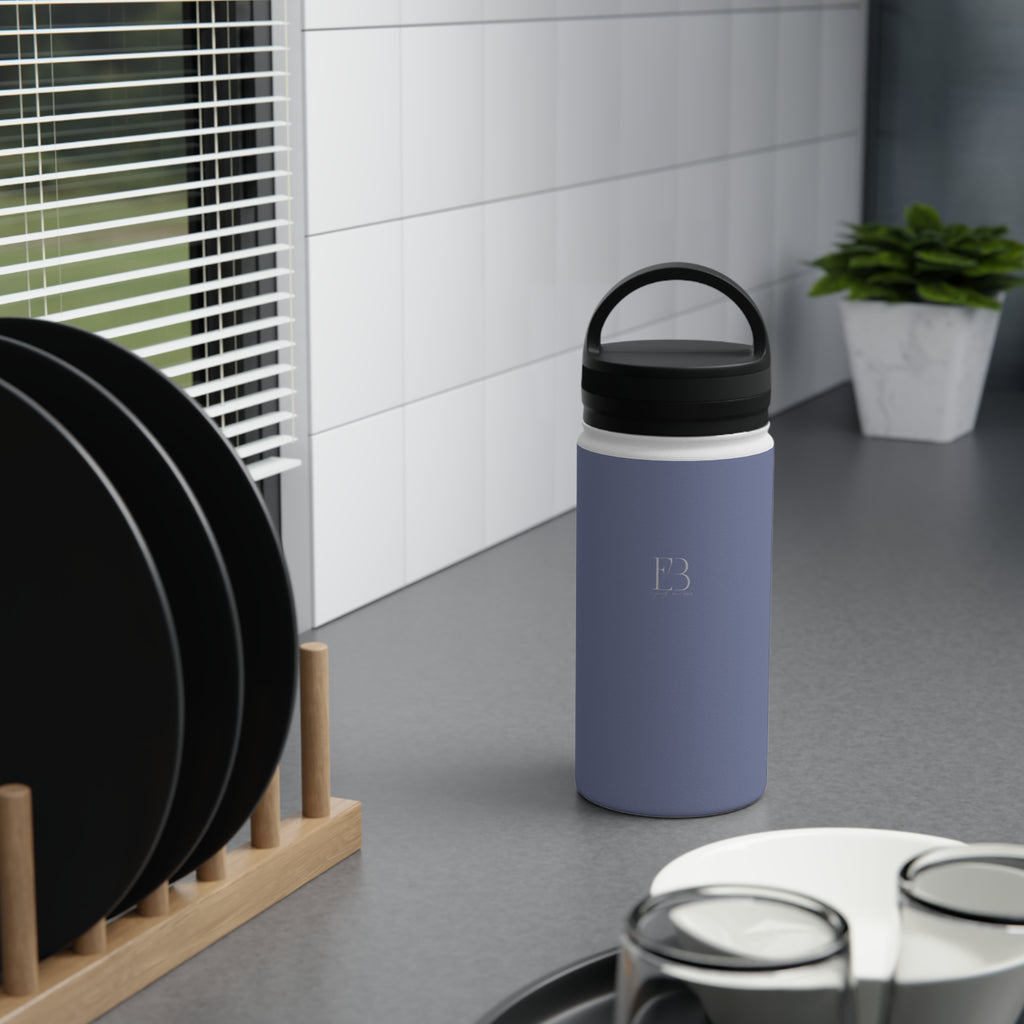 Insulated stainless steel water bottle in pale iris with black handle lid