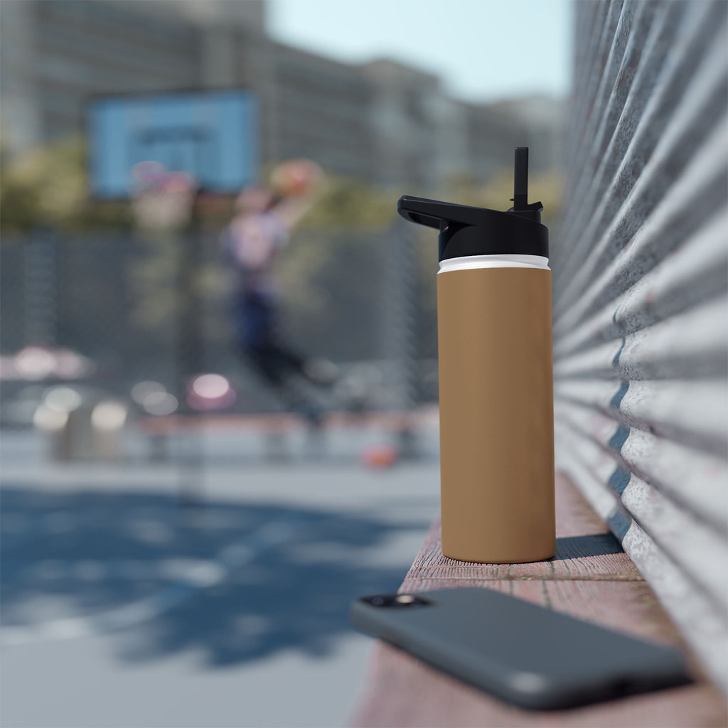 Sandstone insulated stainless steel water bottle with black sports lid on mat