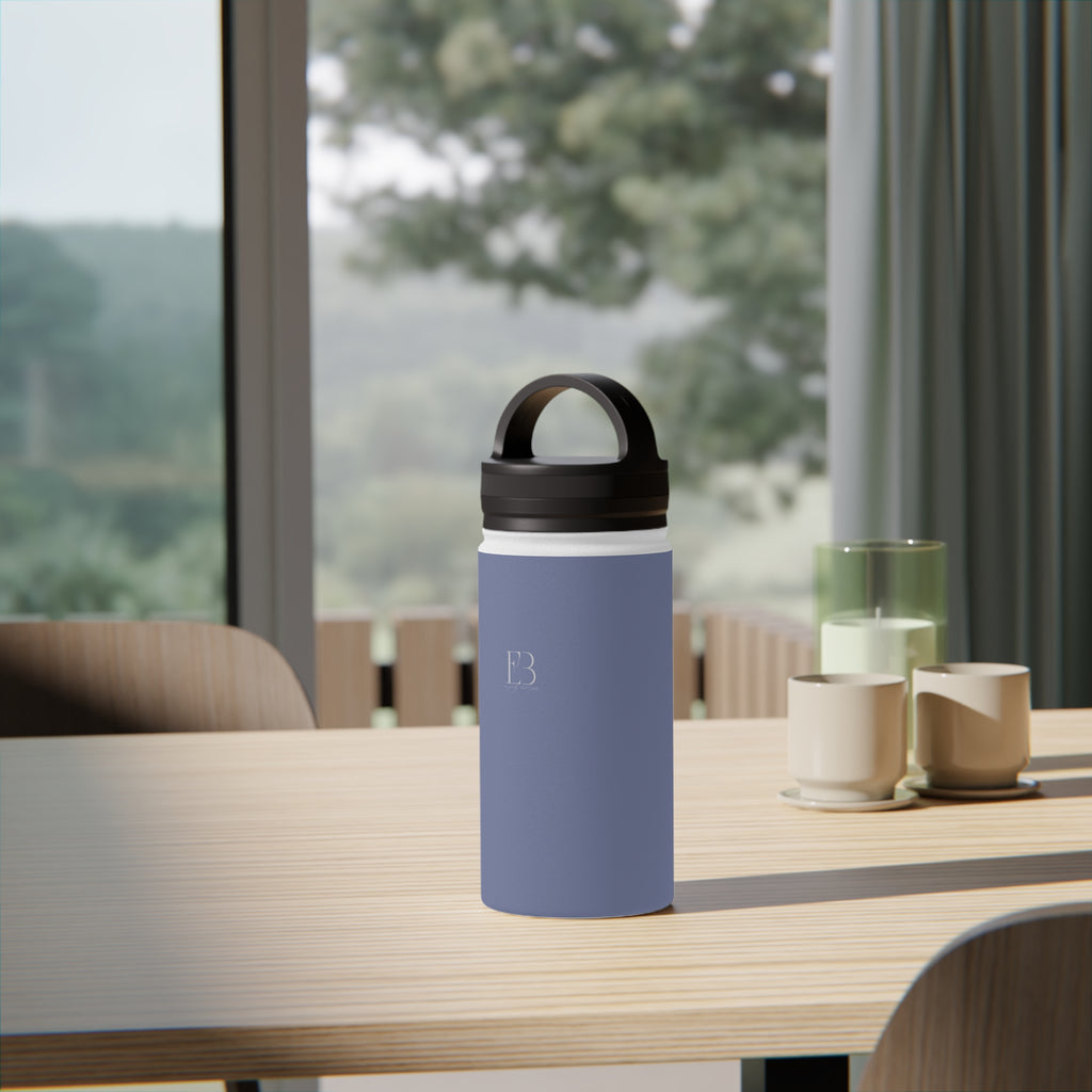 Insulated stainless steel water bottle in pale iris with black handle lid
