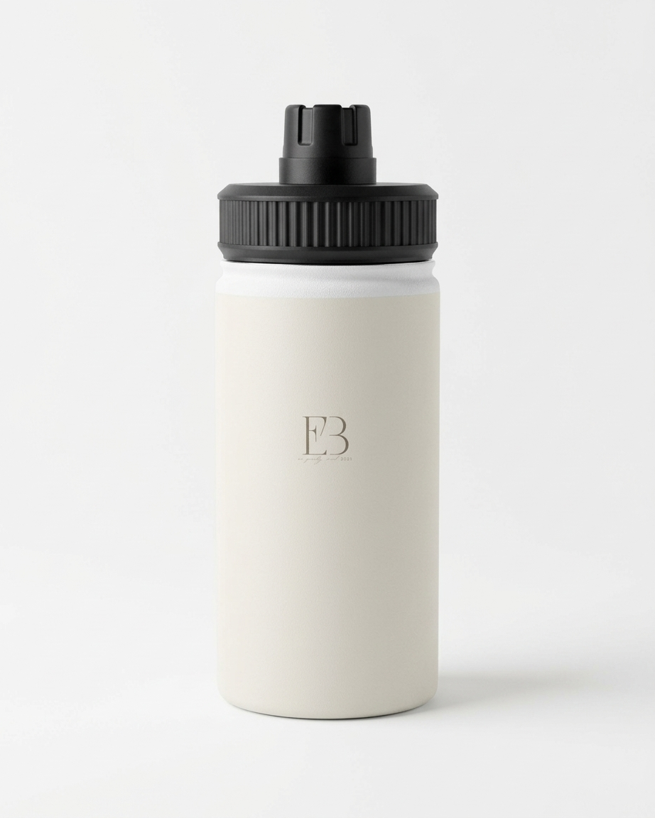 A minimalist insulated water bottle with a matte off-white body and a black screw-on lid, featuring a debossed monogram logo on the front, set against a clean white background.