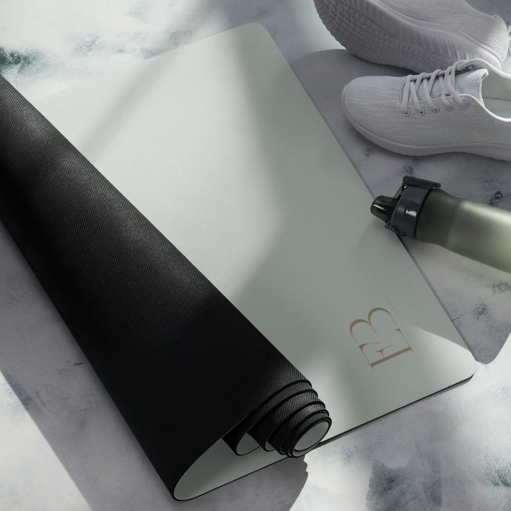 Misty sage yoga mat with black underside rolled edge, textured grip visible
