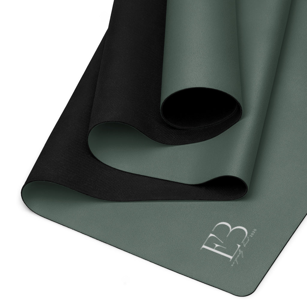 Cypress green yoga mat folded with a non-slip underside texture visible.
