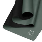 Cypress green yoga mat folded with a non-slip underside texture visible.