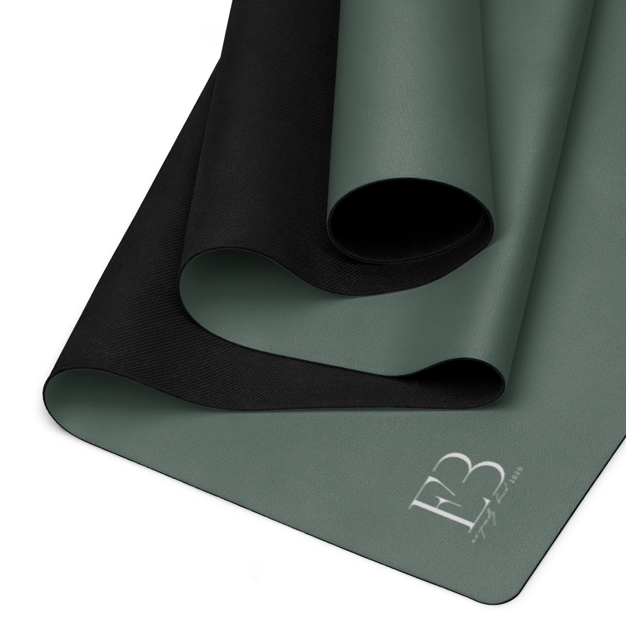 Cypress green yoga mat folded with a non-slip underside texture visible.