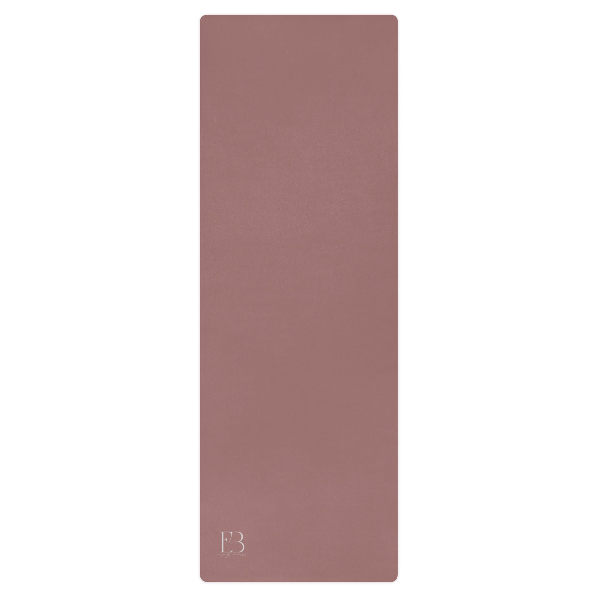 Clay mauve yoga mat with textured surface and logo mark at bottom.