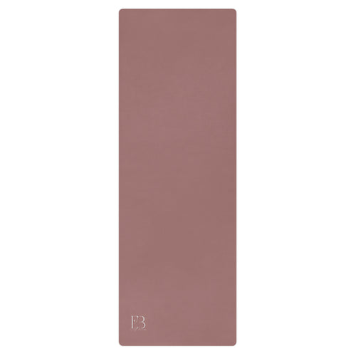 Clay mauve yoga mat with textured surface and logo mark at bottom.