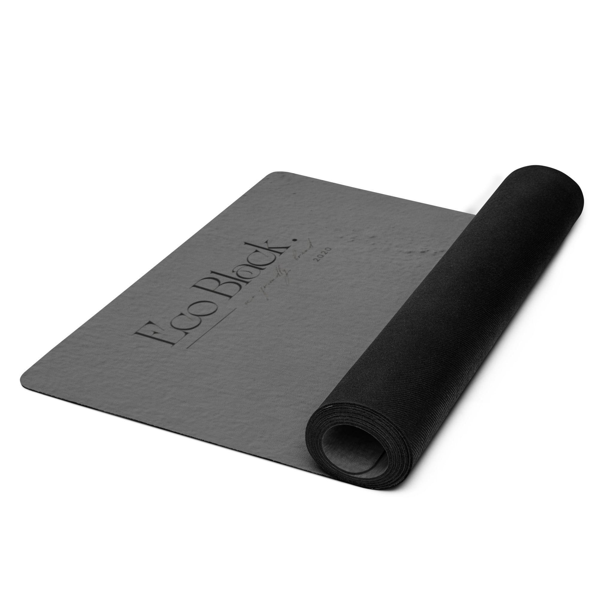 Rolled dark gray yoga mat with Full Black logo and coiled end. Eco Black Dark gray natural rubber yoga mat with Suede top 