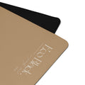 Natural rubber yoga mat corner with black edge trim and white logo.