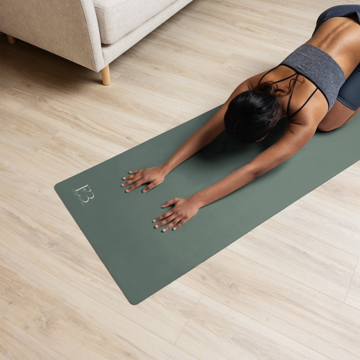 Luxury natural rubber yoga mat in dark green minimalist design for studio practice
