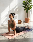 Yoga mat with pink-to-peach gradient design and smooth natural rubber finish