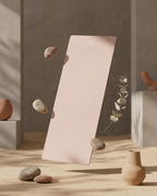 Blush pink yoga mat with white floral accent and black edge