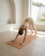 Golden yoga mat used for a hands-and-knees pose