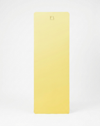 Lemon-yellow natural rubber yoga mat with centered embossed logo