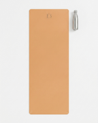 Golden yoga mat with E3 logo and a clear water bottle on a white background