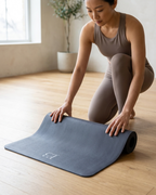 Natural rubber yoga mat in slate blue with rolled edge and embossed logo