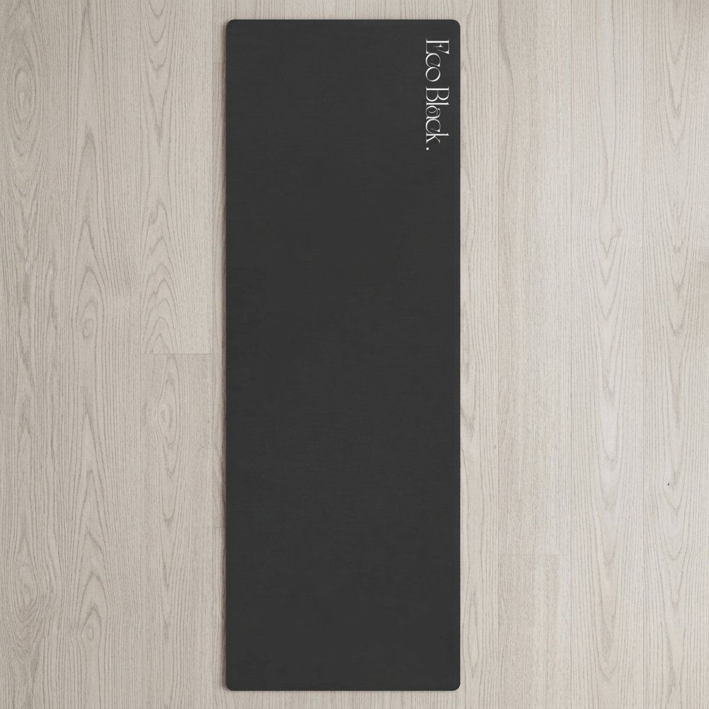 Black yoga mat standing vertically with Eco Block logo near the top.