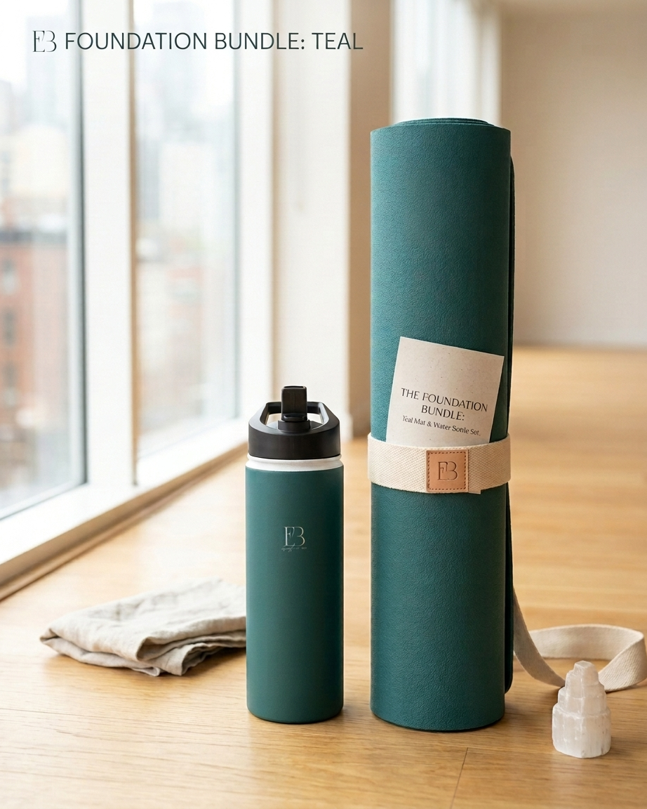 Deep teal rolled yoga mat set with water bottle and small candles