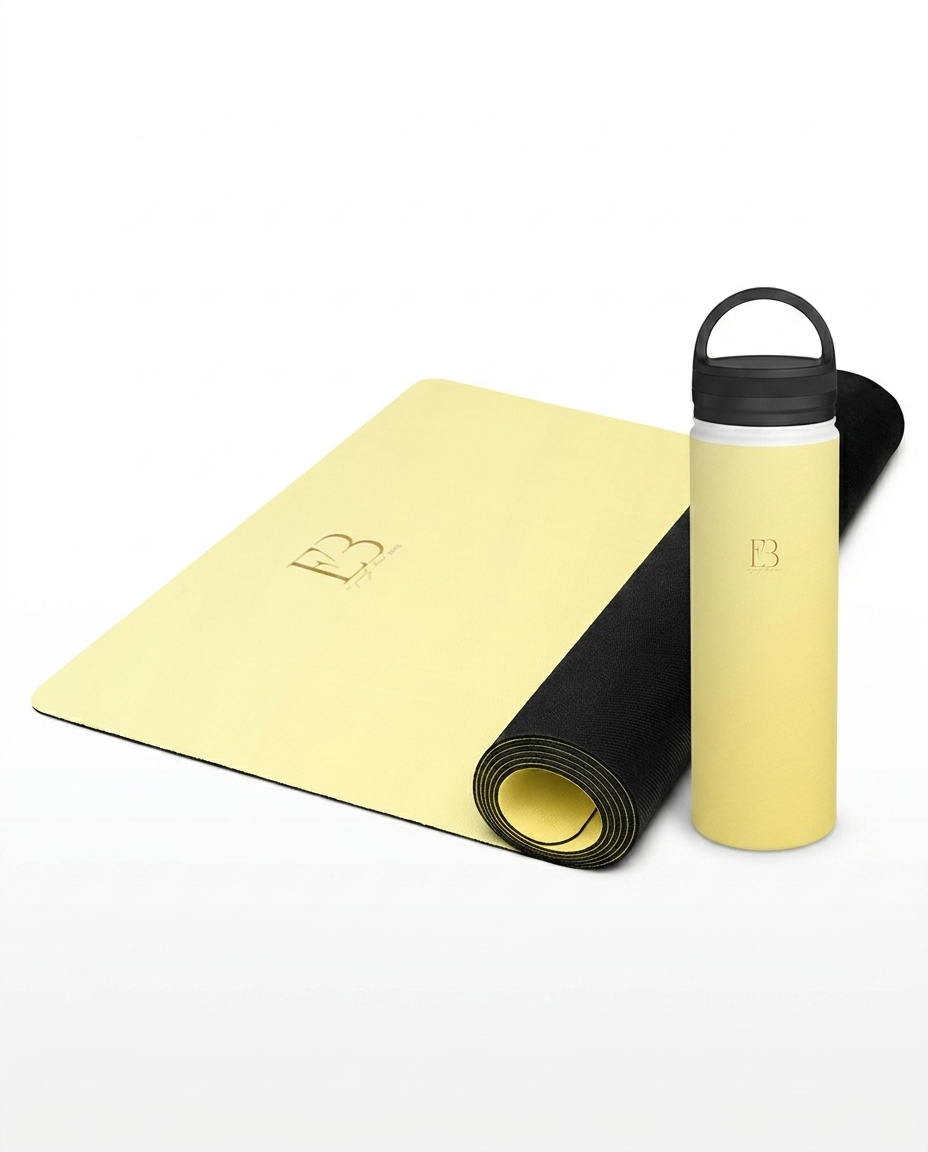 Lemon yellow yoga mat with logo and black-capped water bottle tumbler