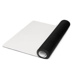 Light gray natural rubber yoga mat, rolled end visible at right edge