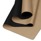 Natural rubber yoga mat with golden tan base and black textured grip layer