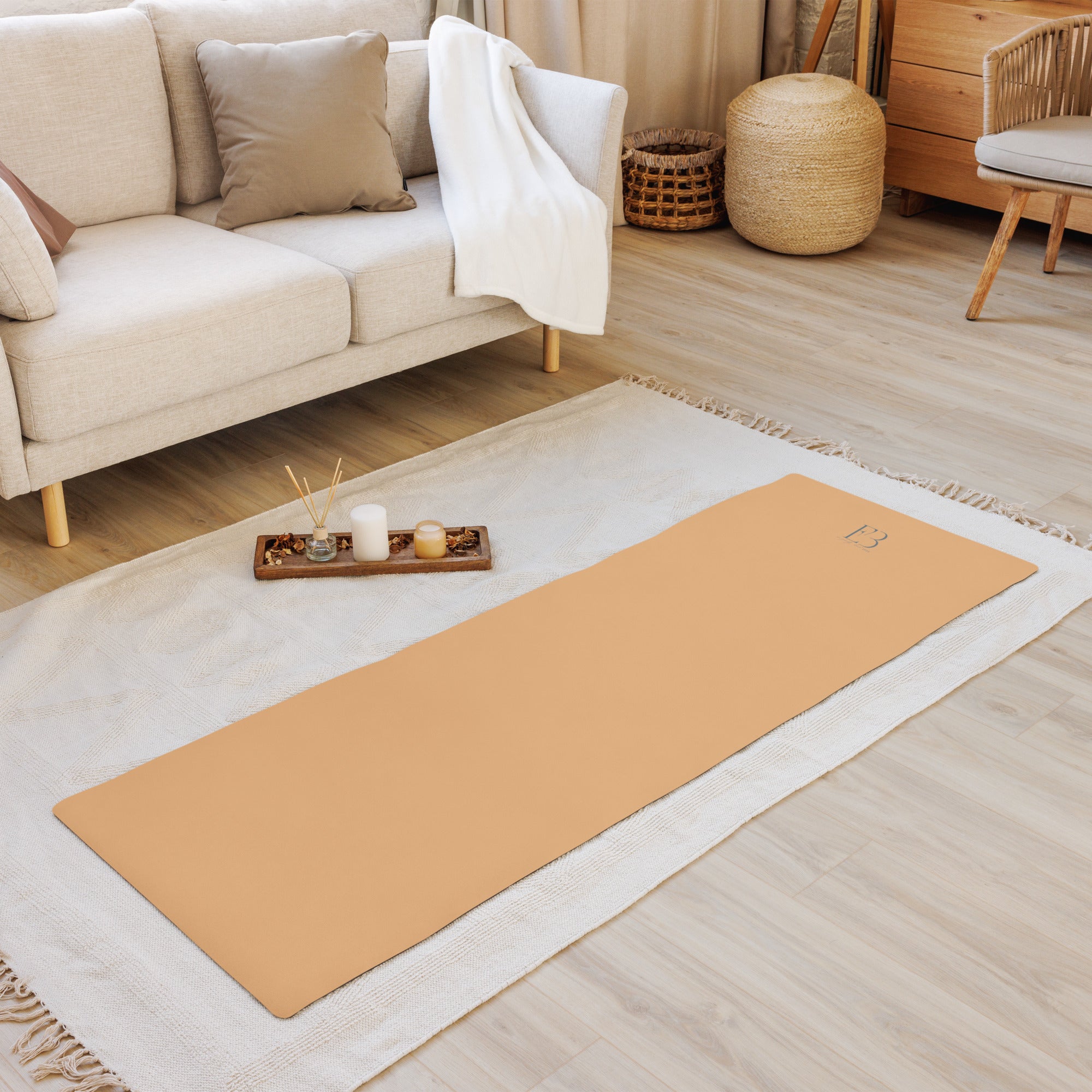 Gold natural rubber yoga mat with FB logo on a white textile runner