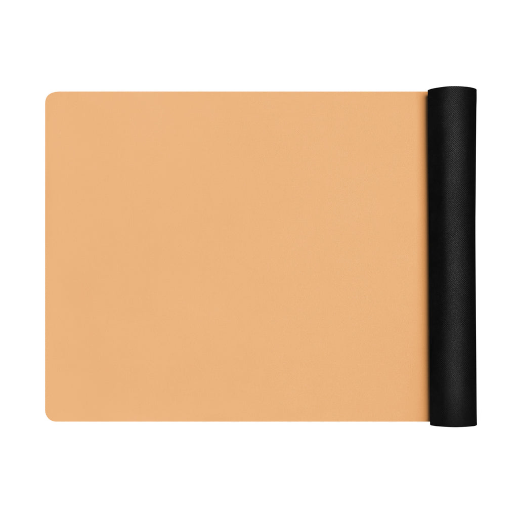 Golden yoga mat with a black rolled end, shown laid out flat