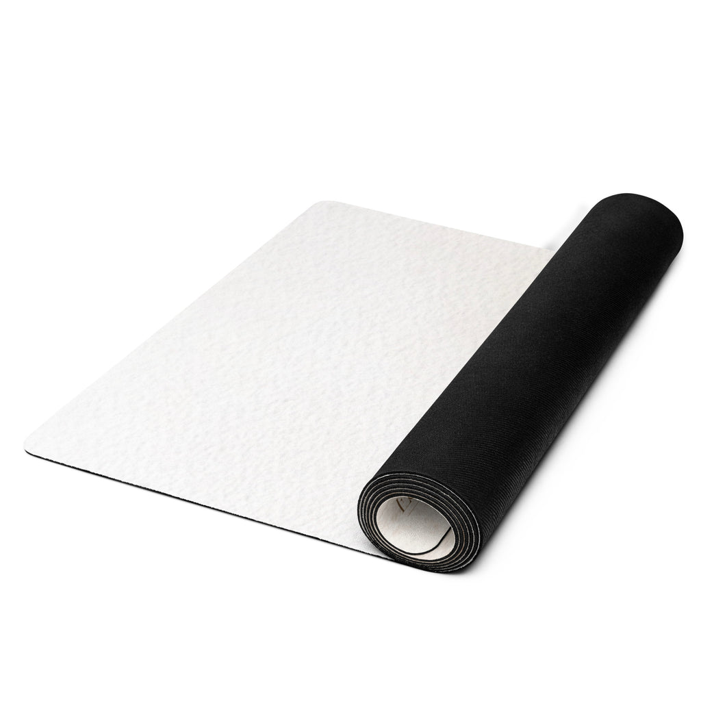 Rolled yoga mat: light beige top with black underside, side view
