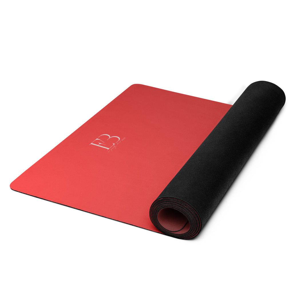 Crimson yoga mat rolled with black edge and embossed logo