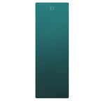 Deep teal natural rubber yoga mat, rectangular design with subtle logo.