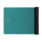 Deep teal yoga mat with B3 logo and black rolled accessory sleeve