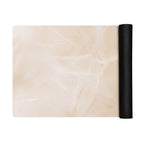 Beige yoga mat with rolled black end for storage