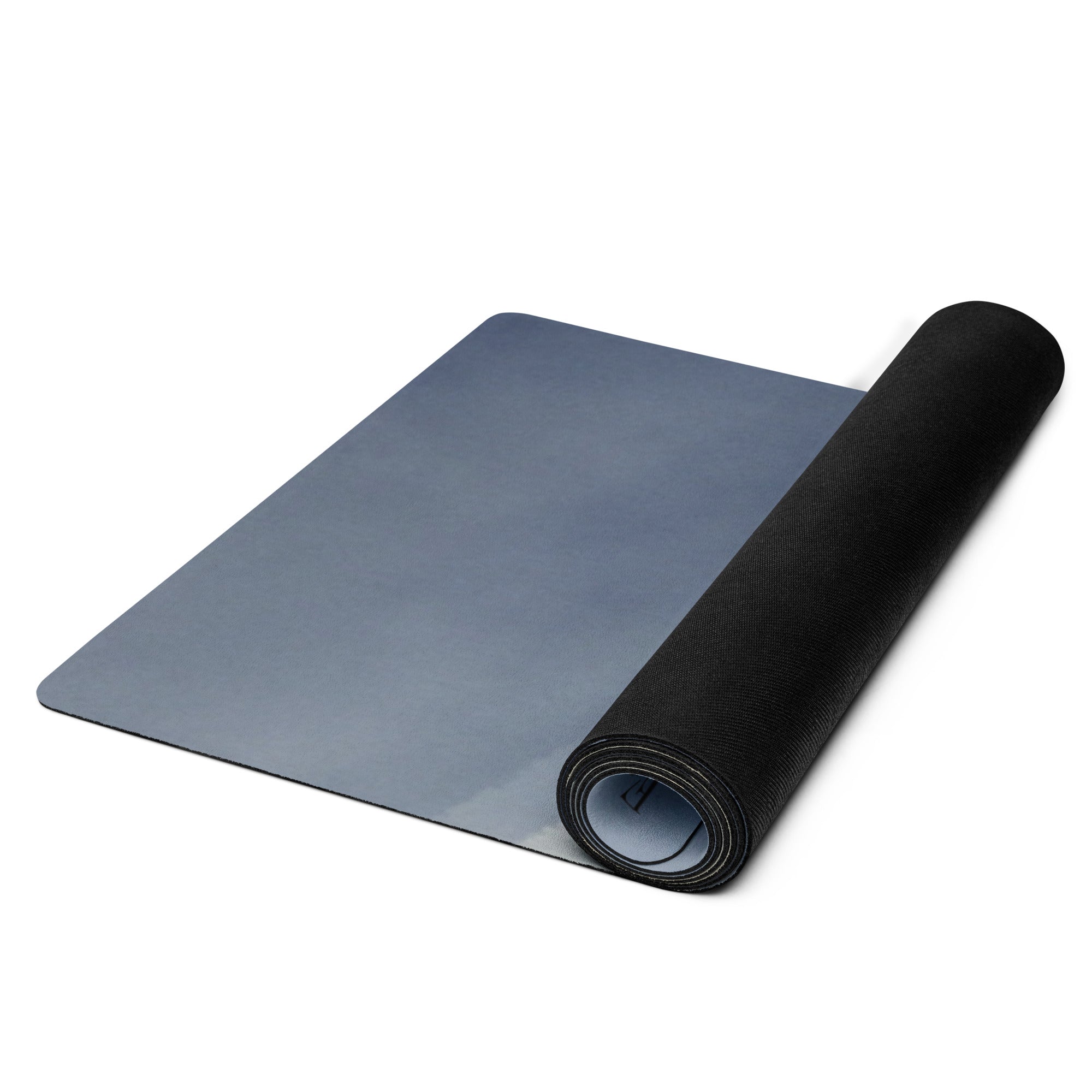 Rolled yoga mat with blue mountain haze print and black base roll.