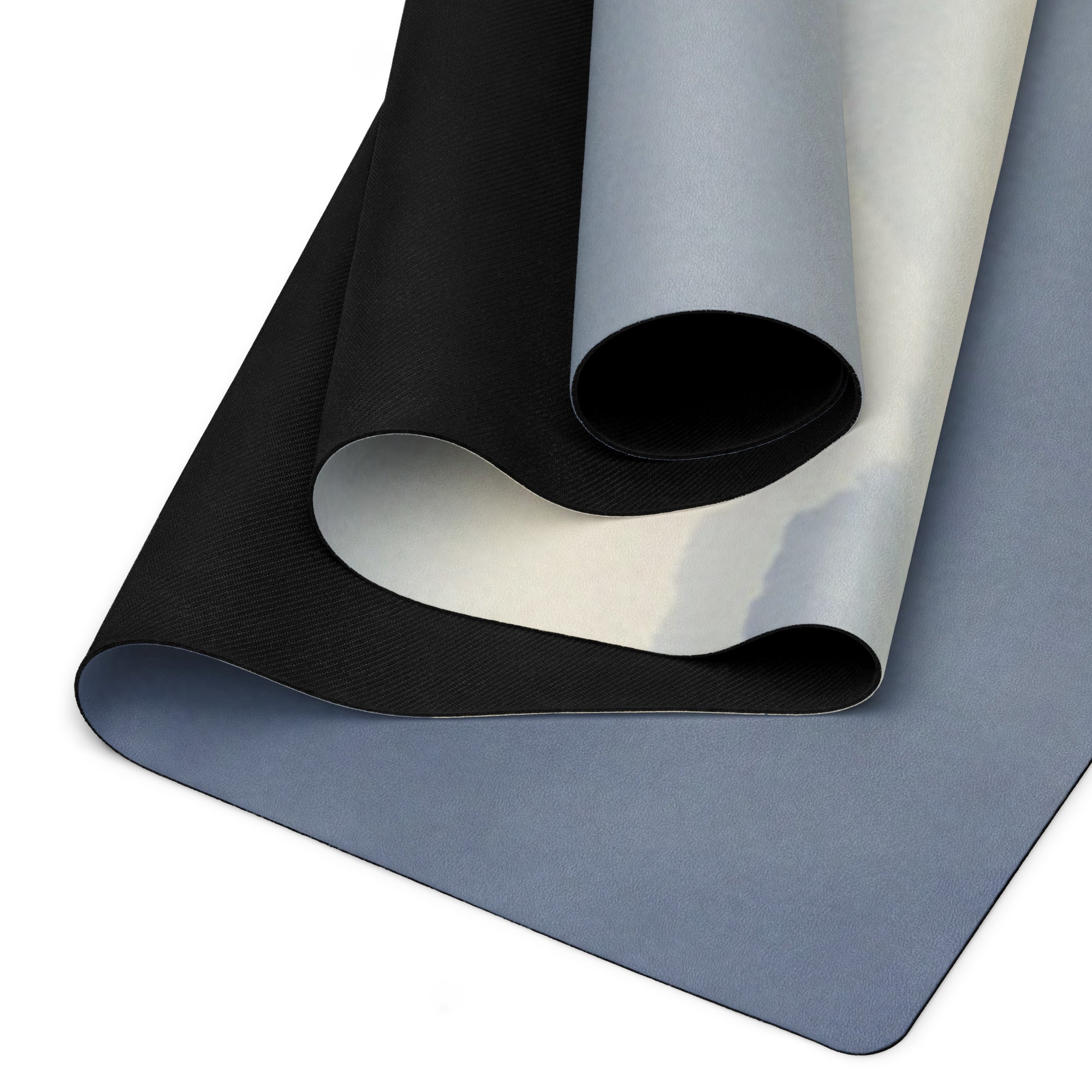 Yoga mat laid flat, showing blue-gray top and dark textured grip underside