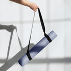 Pale iris natural rubber yoga mat being carried with black strap handles