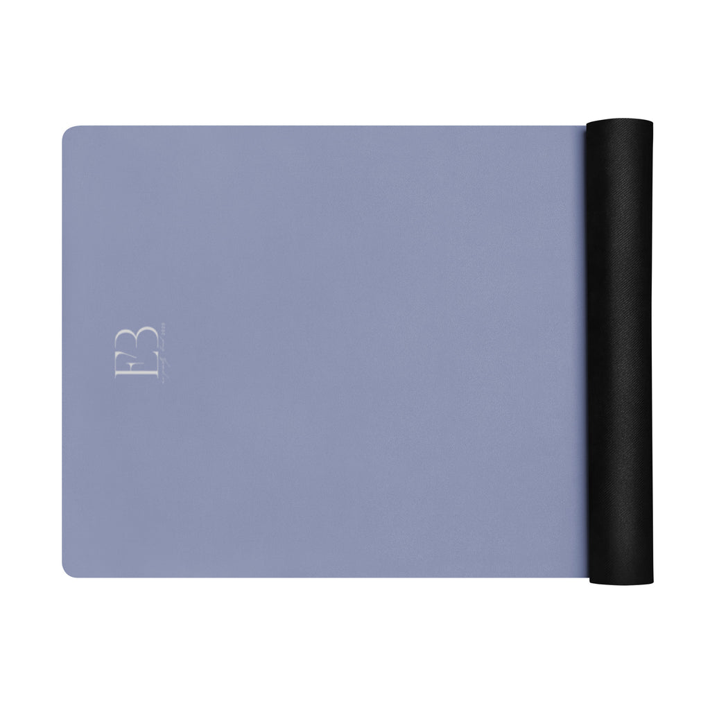 Pale iris natural rubber yoga mat with one end rolled into a tight cylinder