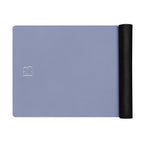 Pale iris natural rubber yoga mat with one end rolled into a tight cylinder