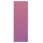Rose-pink yoga mat with embossed logo on smooth surface