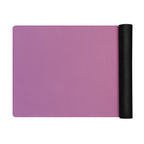 Rose Orchid natural rubber yoga mat, rose-pink with rolled black end on a white background.