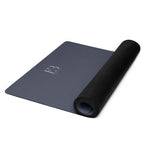Slate blue yoga mat with black rolled end and embossed logo