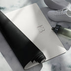 Vanilla cream yoga mat with black strap, paired with a rolled-up mat