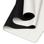 Vanilla cream yoga mat showing black textured underside and rolled edge