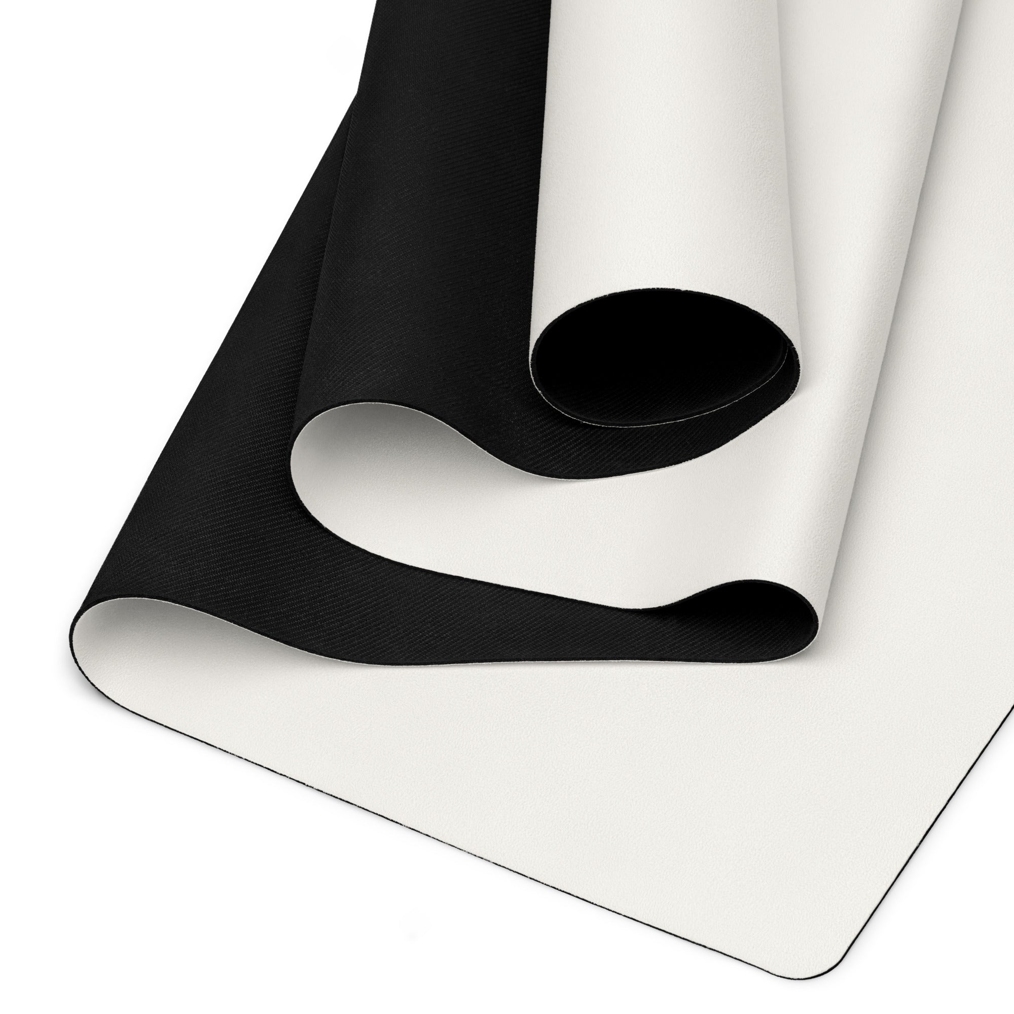 Vanilla cream yoga mat showing black textured underside and rolled edge