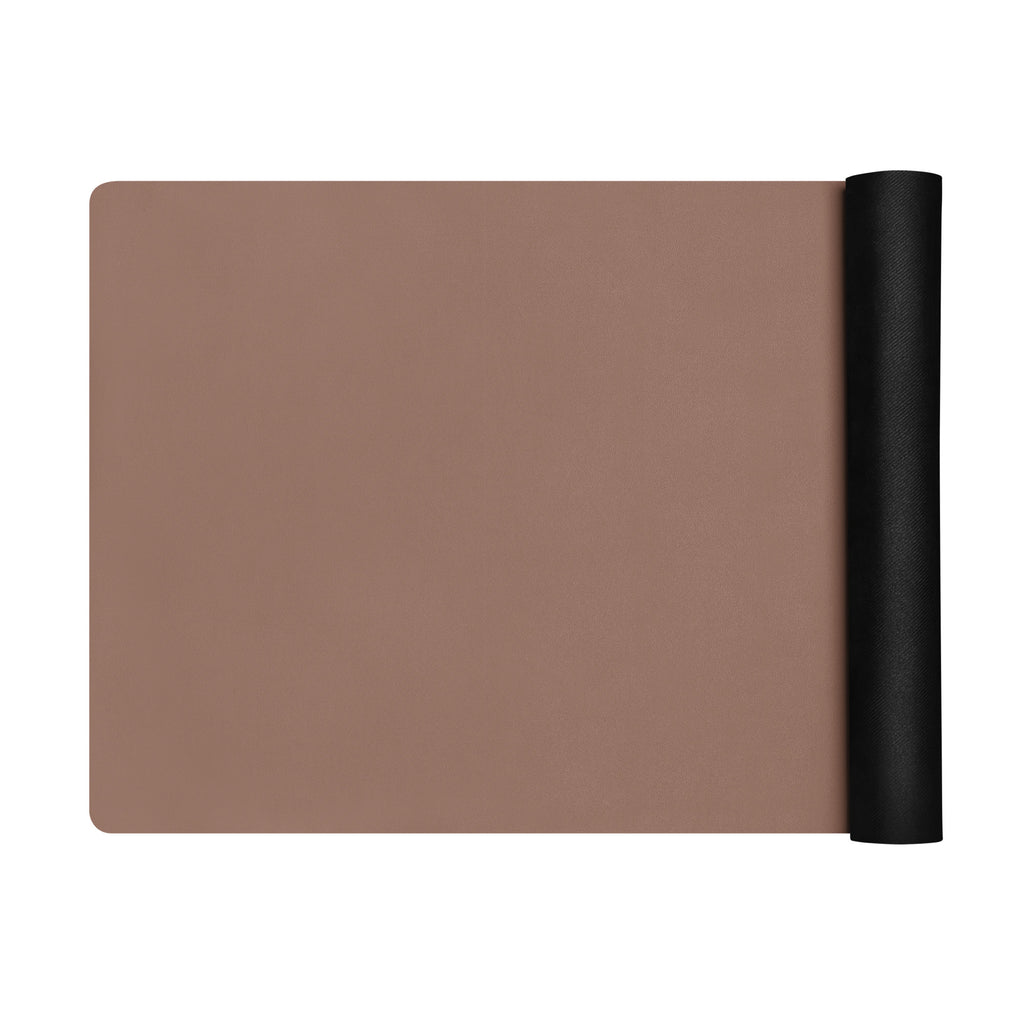 Chocolate yoga mat folded with a black rolled side