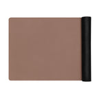 Chocolate yoga mat folded with a black rolled side