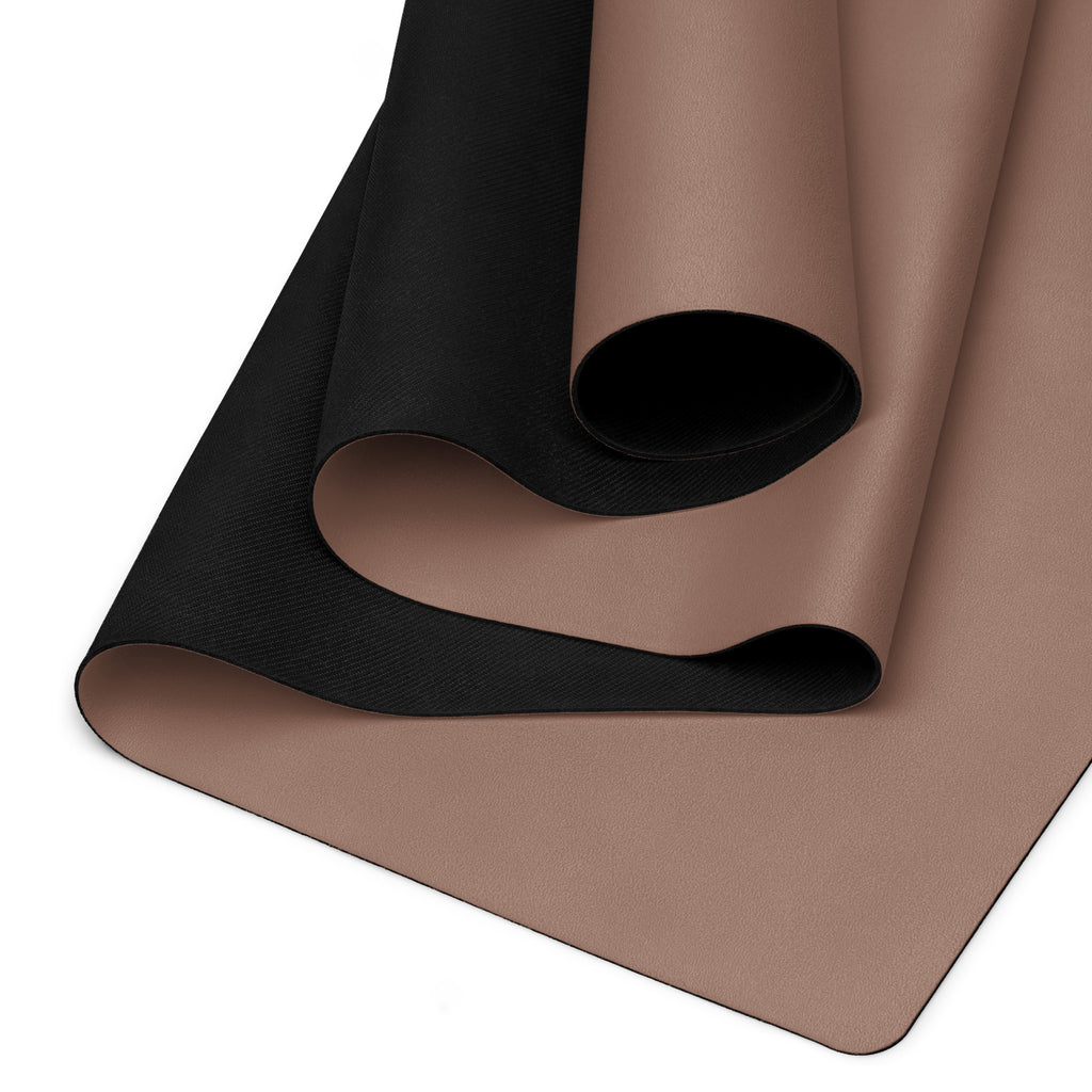 Chocolate yoga mat showing black textured grip underside