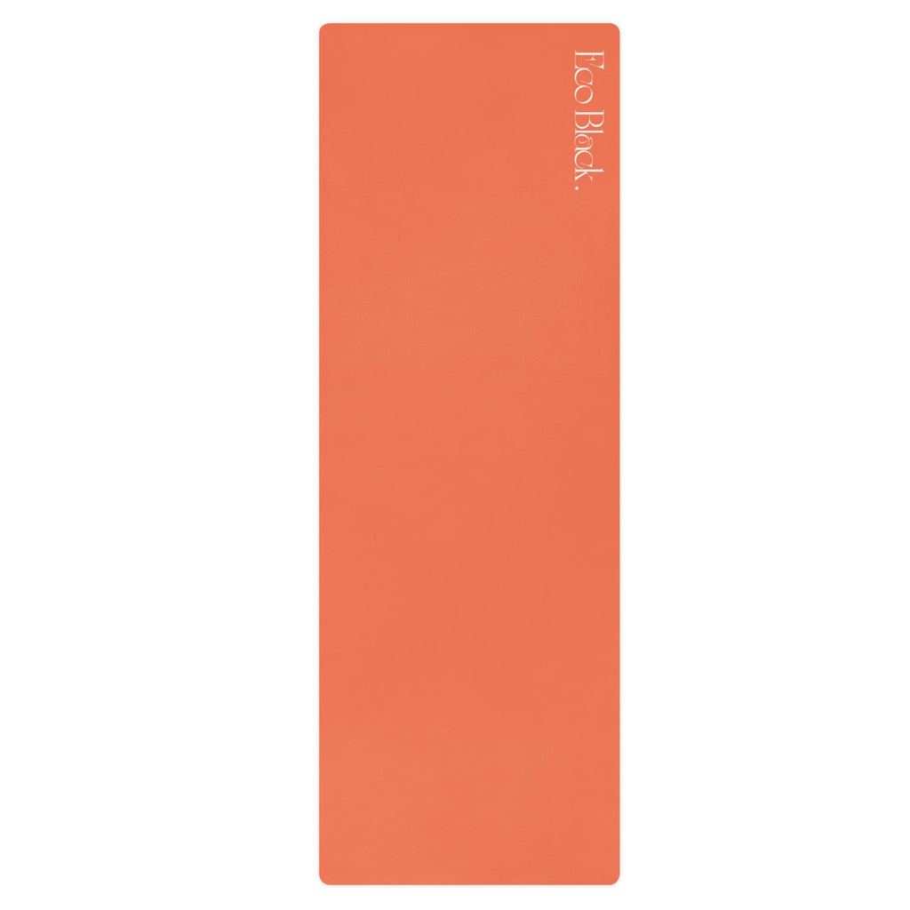 Orange natural rubber yoga mat with rounded corners and subtle embossed logo.