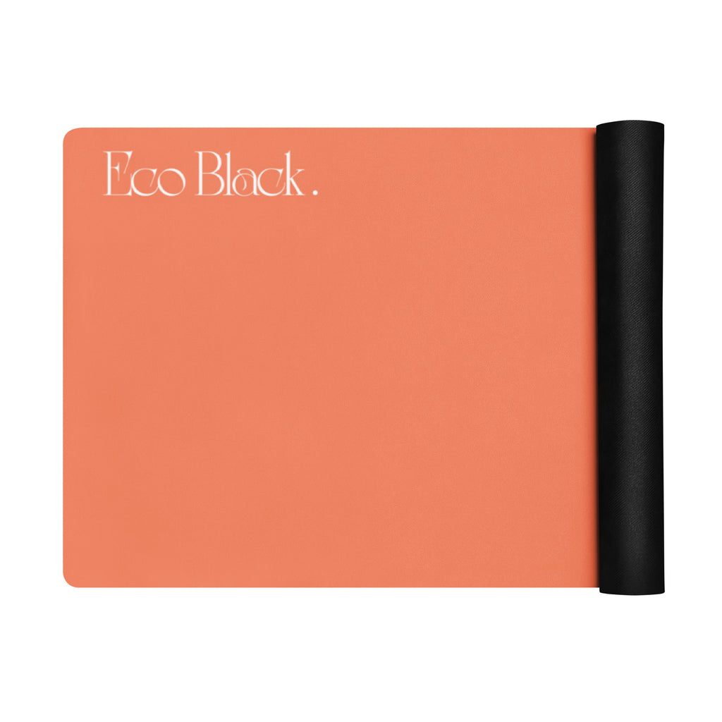 Orange yoga mat with a black rolled edge on the side.