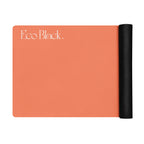 Orange yoga mat with a black rolled edge on the side.