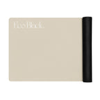 Bone beige yoga mat with black rolled edge on the side, showing embossed branding.