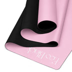 Pink yoga mat with black textured bottom edge and visible “Eco Black” logo